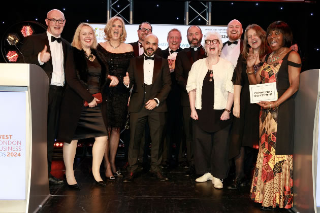 The Action West London team celebrates its award 