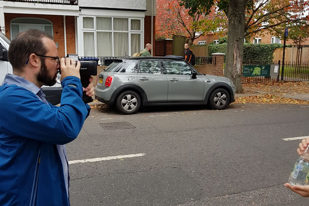 Cllr Gary Malcolm checking the speed of vehicles near the site of the new crossing 
