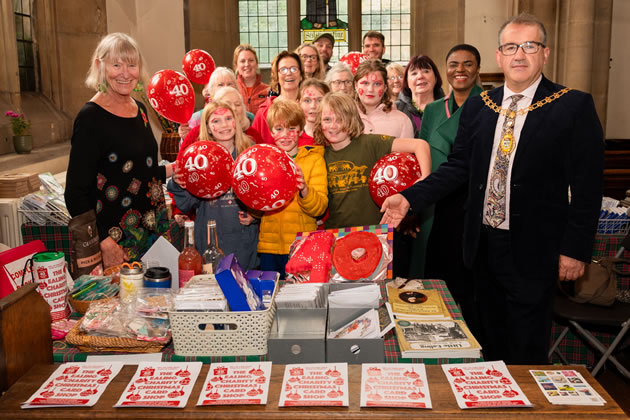 (Left): Sue Green, Founder, Ealing Charity Christmas Card Shop Councillor and (right) Anthony Kelly, Mayor of Ealing along with volunteers and representatives of some of the charities supporte