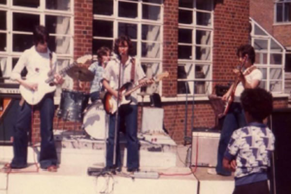 Bandmembers performing while they were at school in the borough