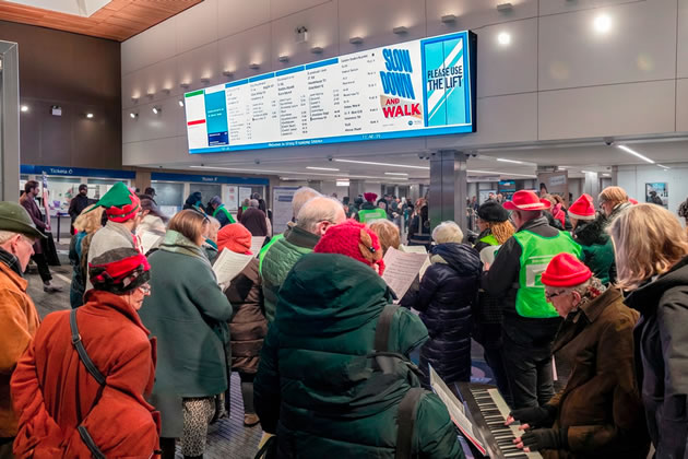 Carol singers at Ealing Broadway station. Picture: Roger Green 