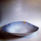 A bowl with a yellow tape  Description automatically generated