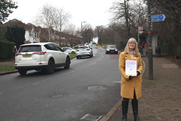 Lib Dem councillor Jenifer Gould on Cannon Hill Lane with a petition for a zebra crossing