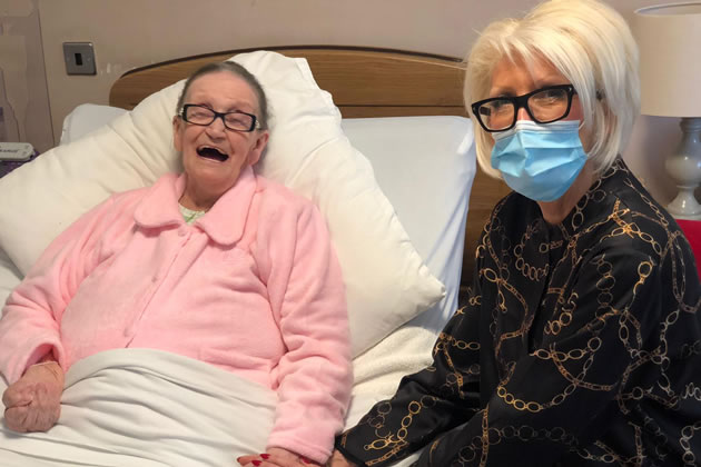 A resident shows delight at meeting her daughter again