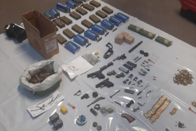 Some of the ammunition and guns found during the raids