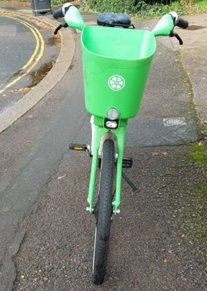 Lime bike on the pavement