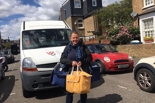 A guild volunteer making deliveries during the pandemic